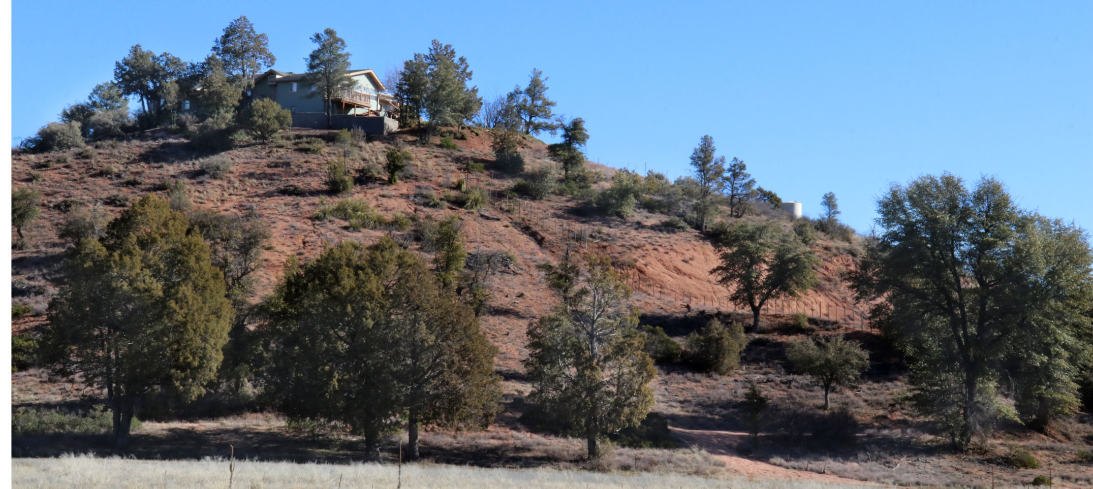 House on hill overlooking Monument Peak Loop Trail
